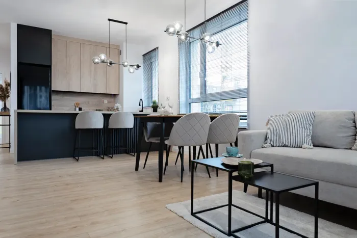 Sleek compact kitchen and dining area inside a two-storey Toronto laneway suite