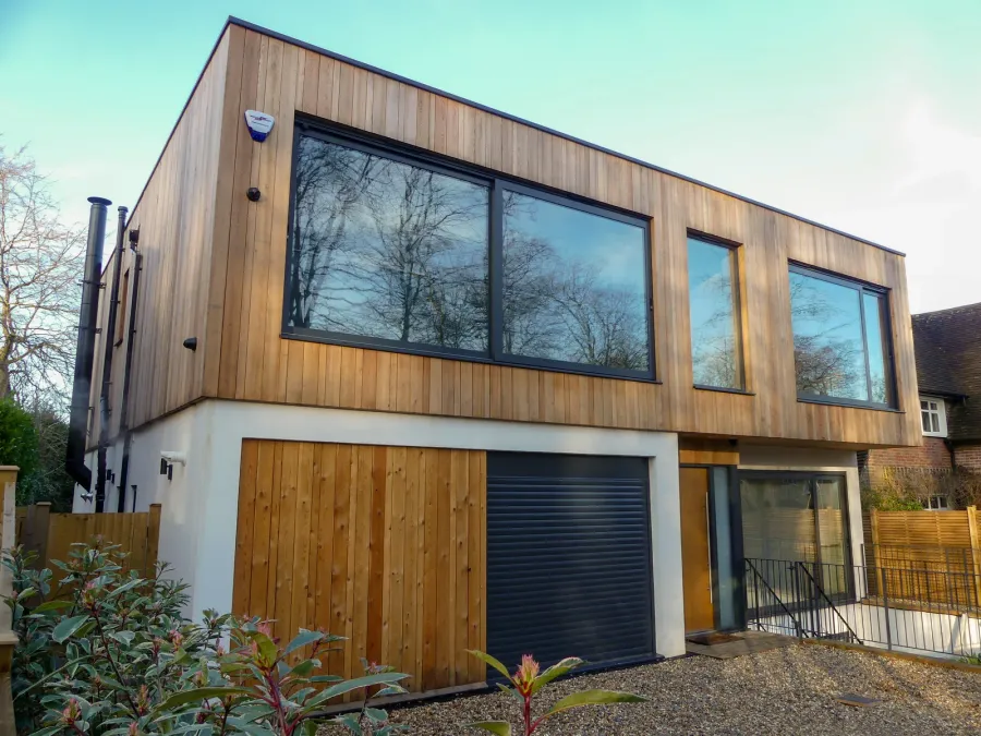 Modern custom garden suite with large windows and a private entrance in a landscaped Toronto backyard, designed and built by Home Garden Suites