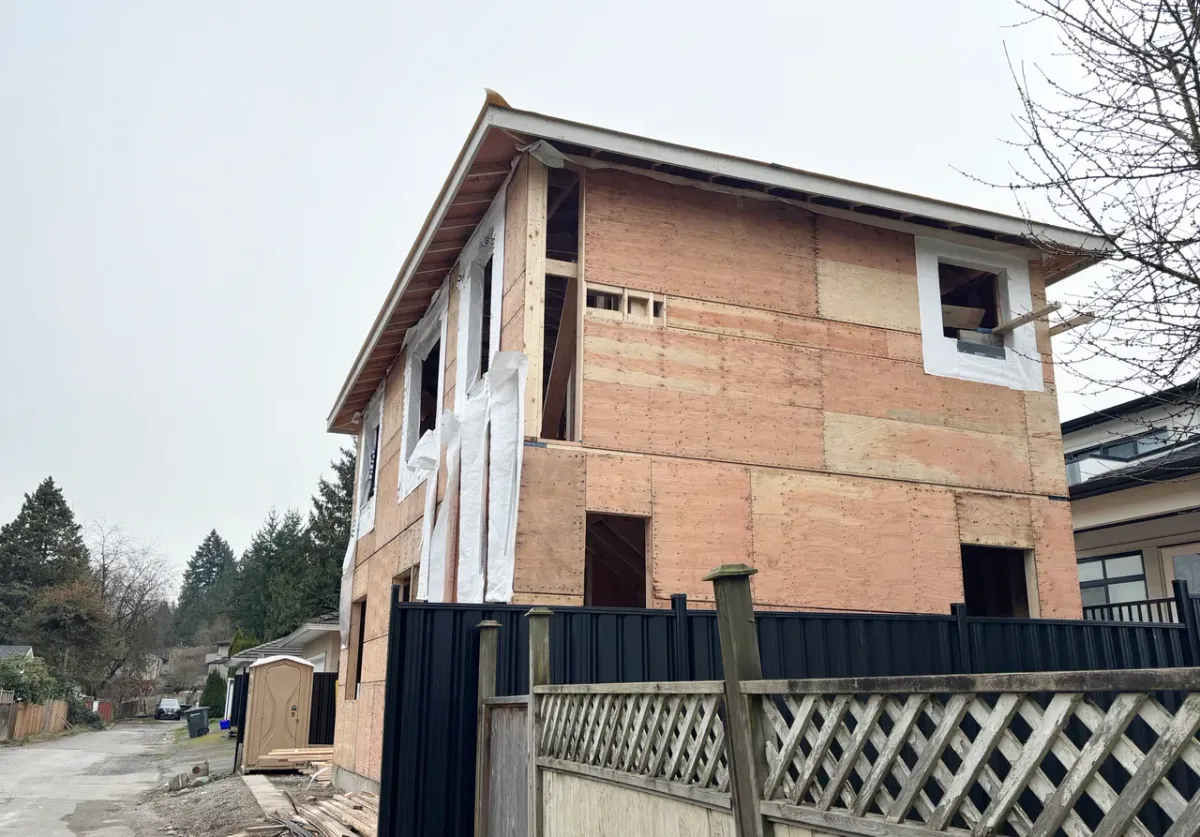 Two-storey laneway suite with private laneway access behind a Toronto home