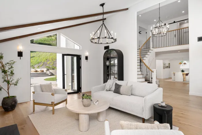 Open living space with high ceilings on the main floor of a two-storey garden suite