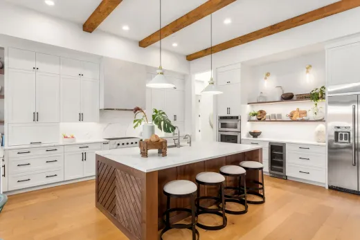 Garden suite kitchen with white cabinetry and exposed beams in a Mississauga rental suite